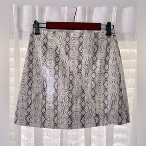 After Market printed skirt with a functional zipper detail across the front.